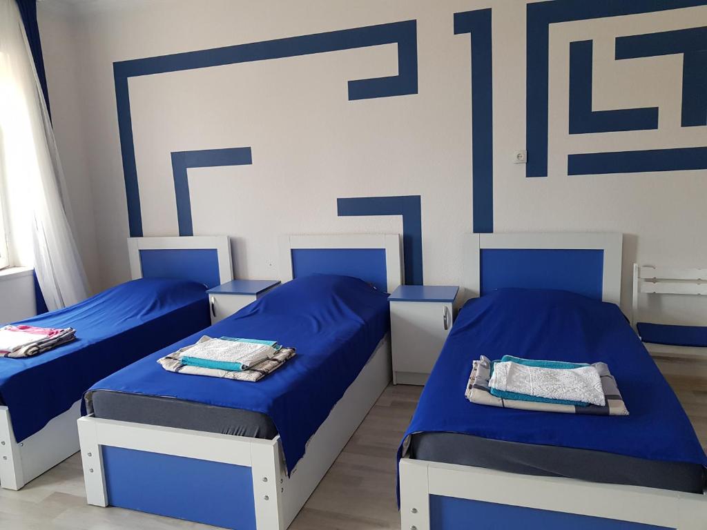 Postel nebo postele na pokoji v ubytování guest house Telavi XXI