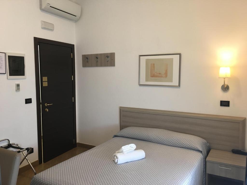 Postel nebo postele na pokoji v ubytování Hotel Chopin