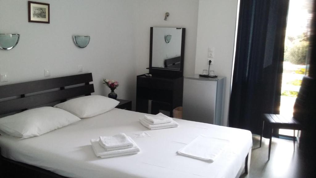 Postel nebo postele na pokoji v ubytování Delfini Hotel