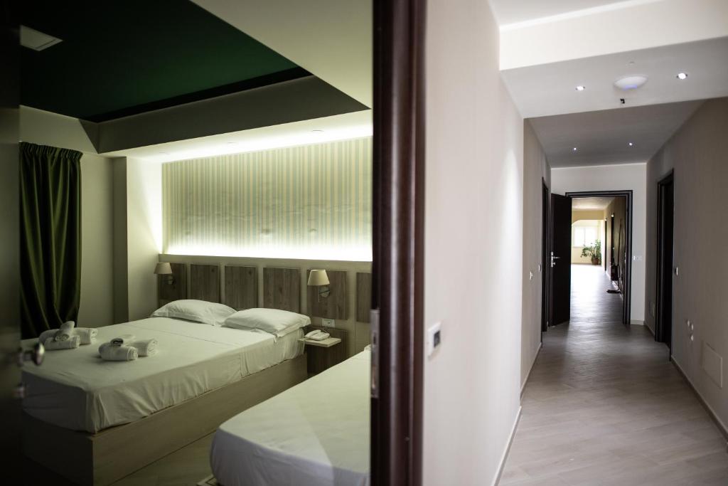Postel nebo postele na pokoji v ubytování Hotel Cliché