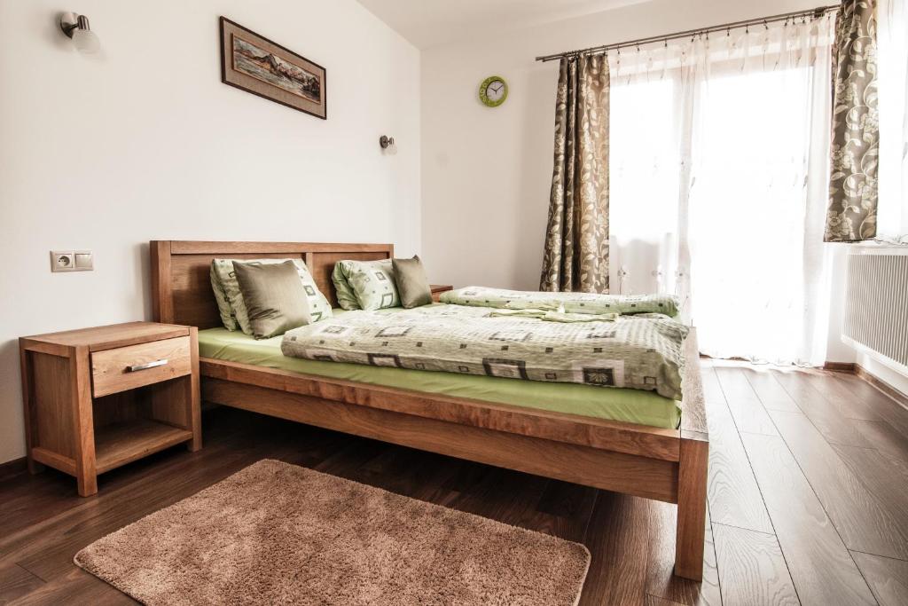 Postel nebo postele na pokoji v ubytování Apartmanovy Dom Martha a Domček Martuška