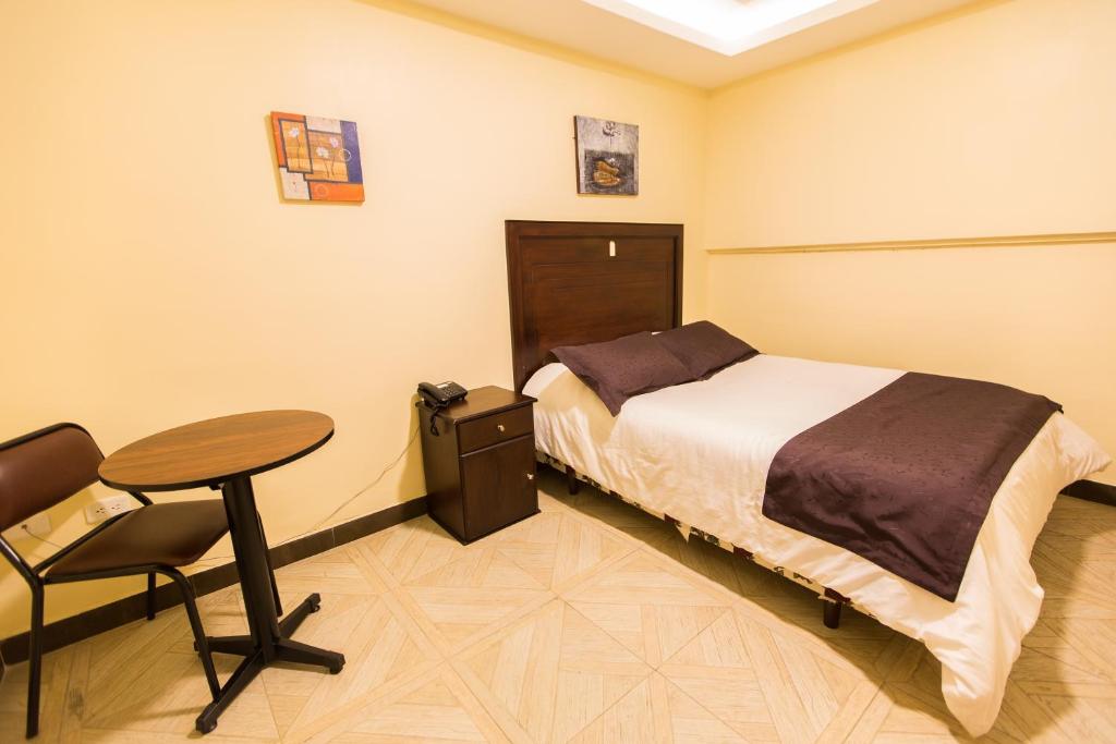 Postel nebo postele na pokoji v ubytování Hotel Saint Thomas