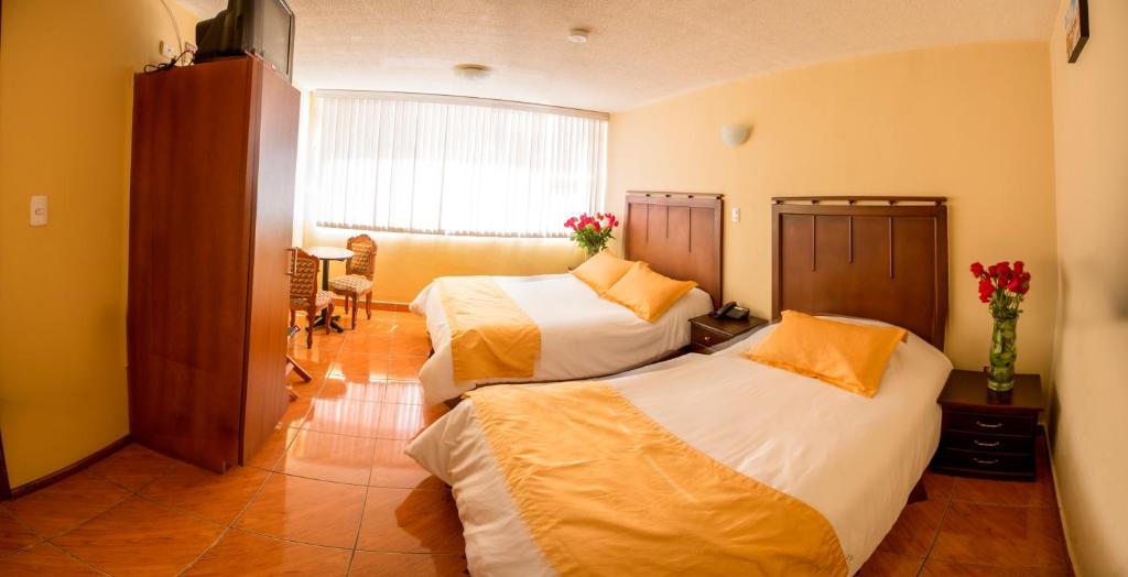 Postel nebo postele na pokoji v ubytování Hotel Saint Thomas