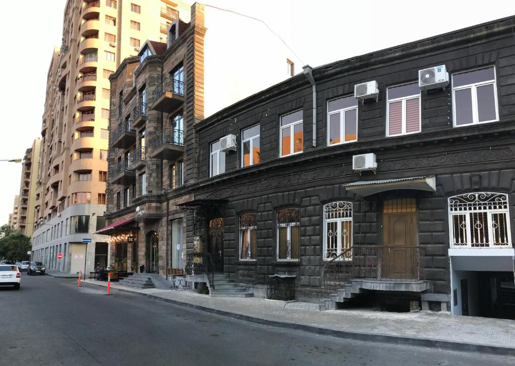 a building on the side of a city street at Apartment by Family Hotel in Yerevan