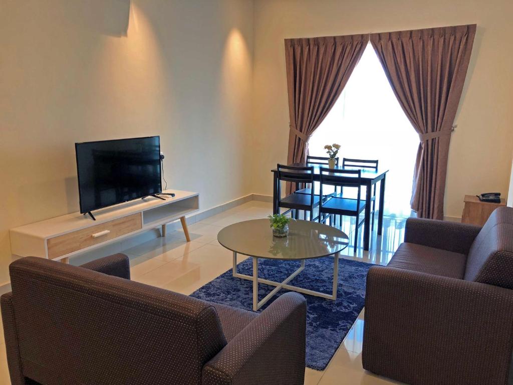 TV a/nebo společenská místnost v ubytování Aman Hills Hotel