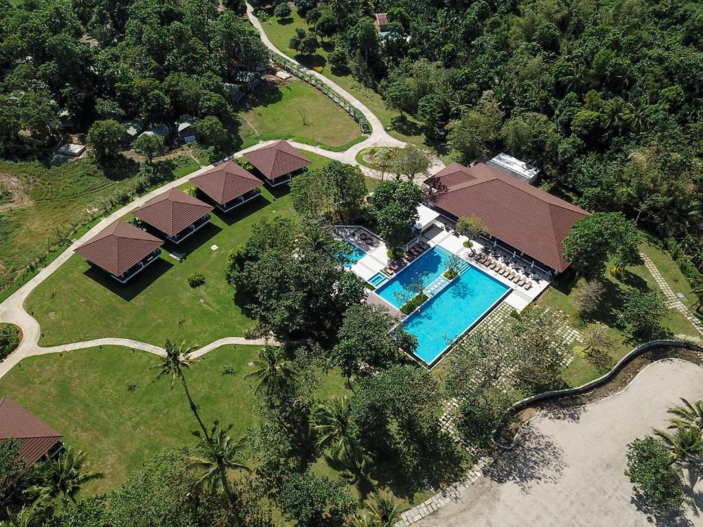 an overhead view of a house with a swimming pool at Solina Beach & Nature Resort in Carles