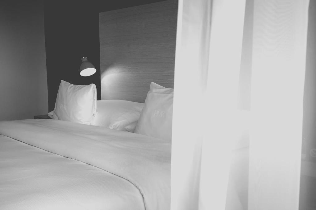 Postel nebo postele na pokoji v ubytování Hotel Mon Repos