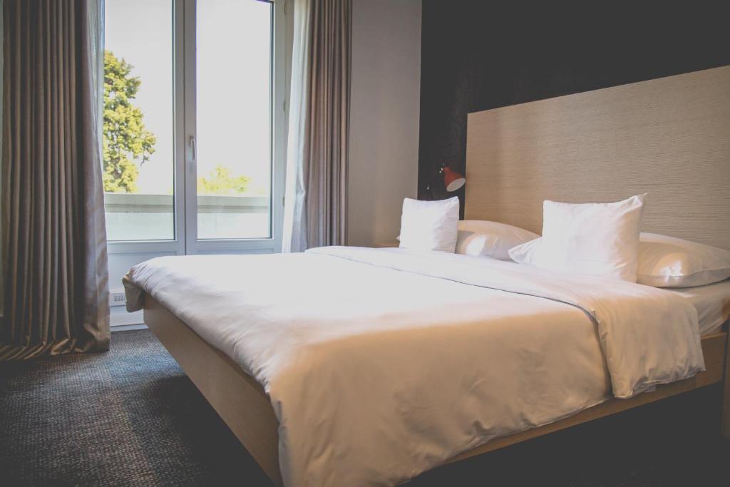 Postel nebo postele na pokoji v ubytování Hotel Mon Repos