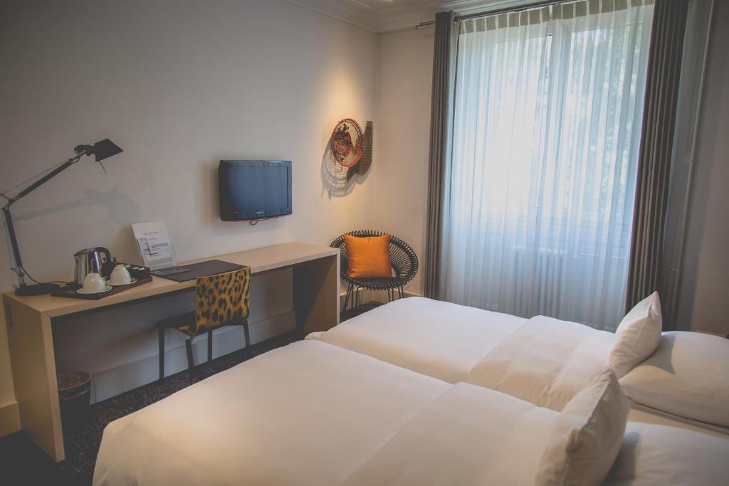 Postel nebo postele na pokoji v ubytování Hotel Mon Repos