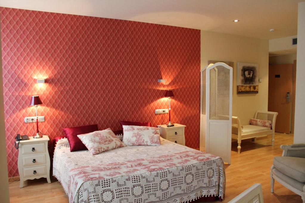 Postel nebo postele na pokoji v ubytování Hospedium Hotel Vittoria Colonna