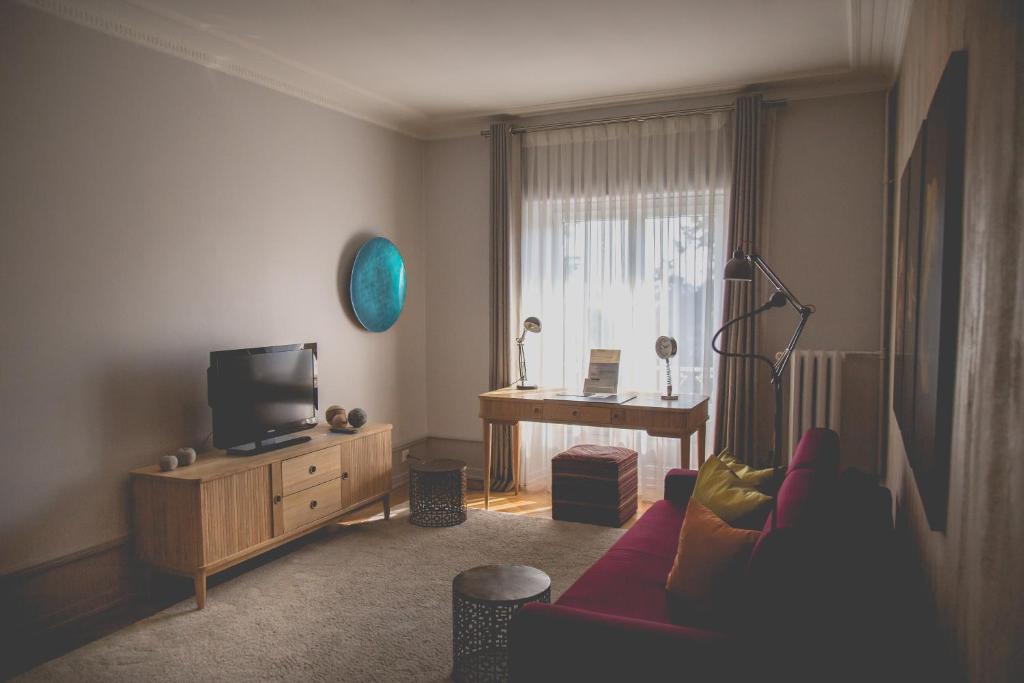 TV a/nebo společenská místnost v ubytování Hotel Mon Repos