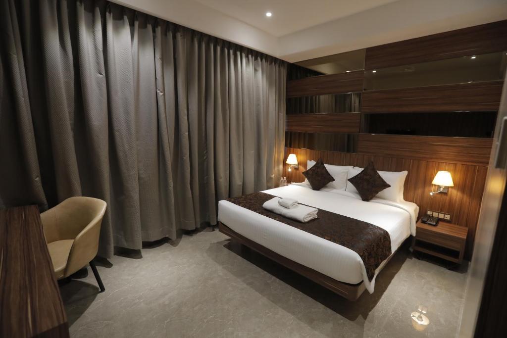 Postel nebo postele na pokoji v ubytování Hotel Radiance