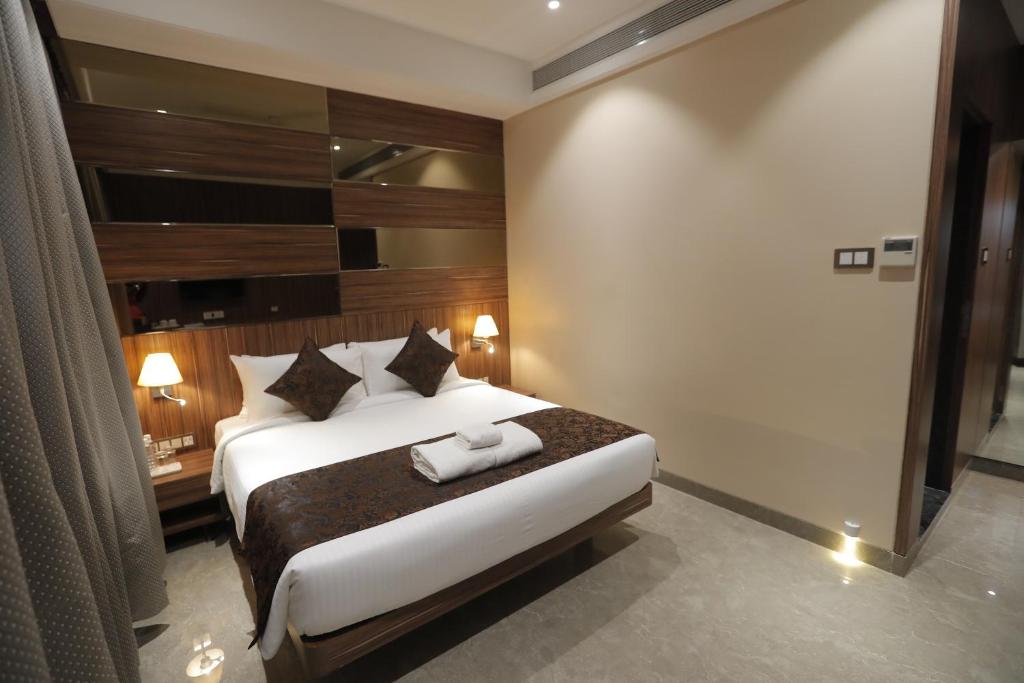 Postel nebo postele na pokoji v ubytování Hotel Radiance