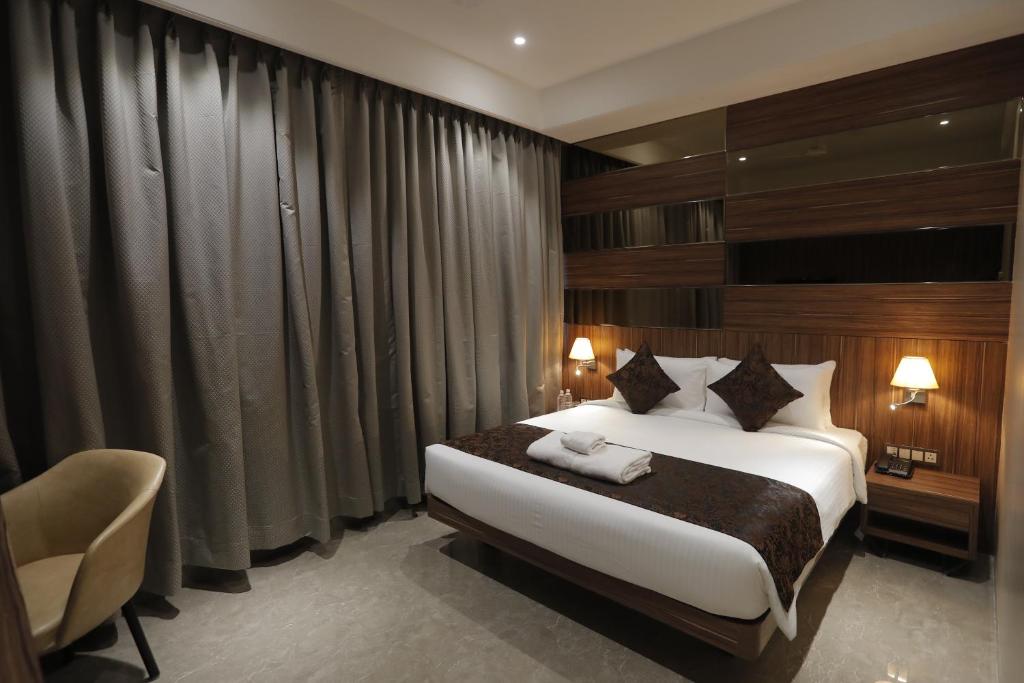 Postel nebo postele na pokoji v ubytování Hotel Radiance