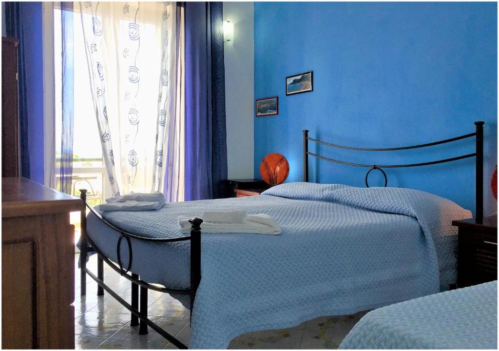 Postel nebo postele na pokoji v ubytování Hotel Ortensia