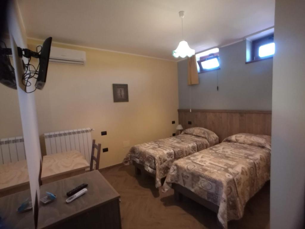 Postel nebo postele na pokoji v ubytování Lacus Pensilis