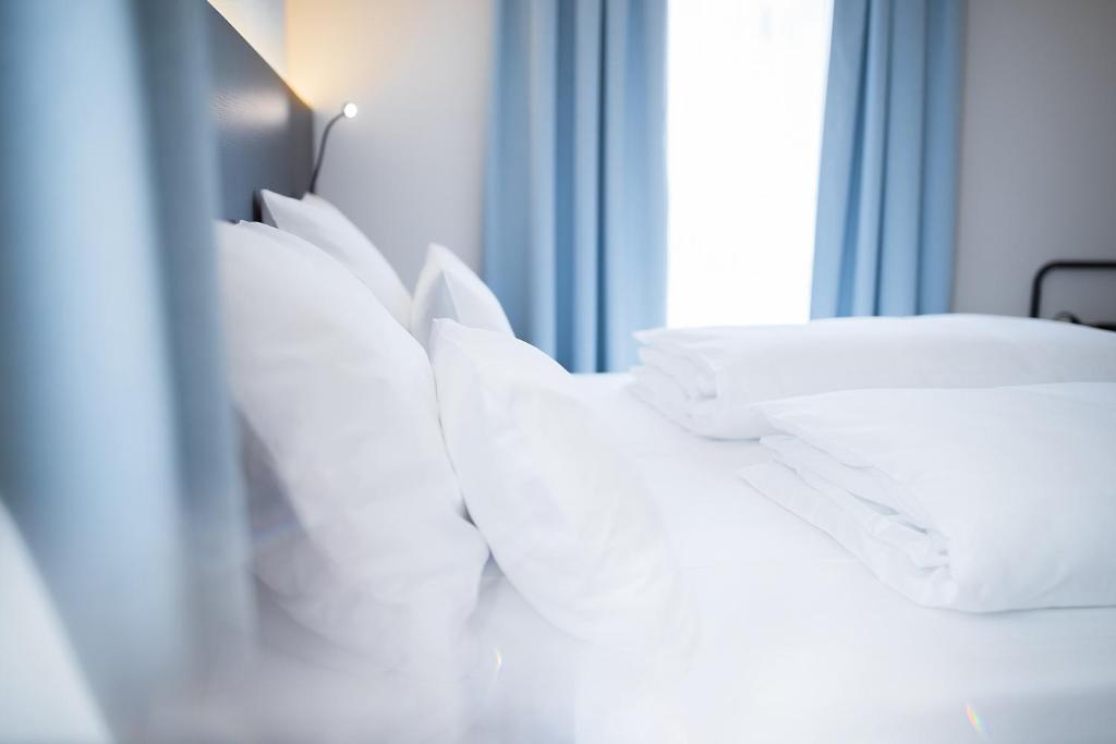 Postel nebo postele na pokoji v ubytování Hotel U7