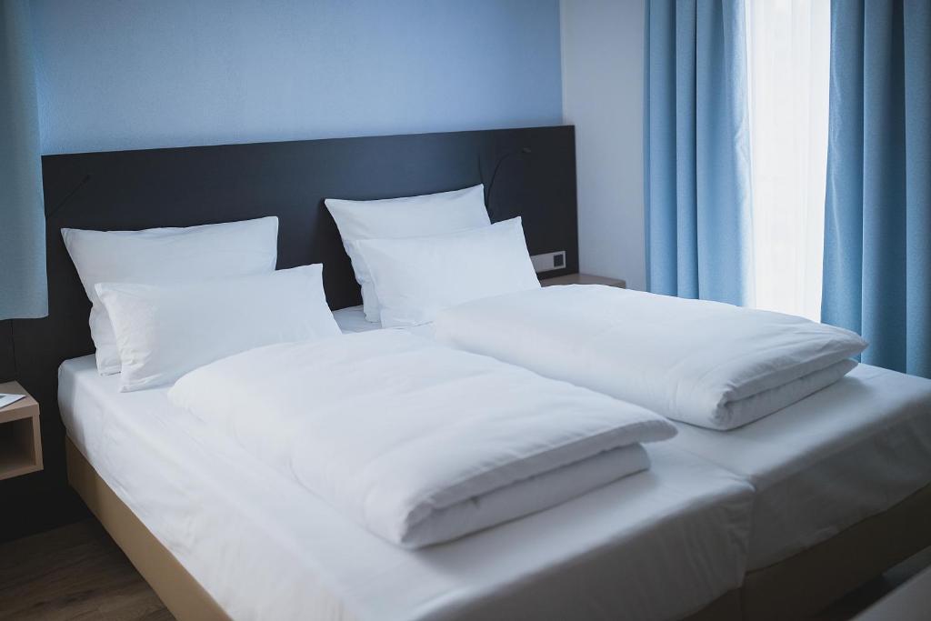 Postel nebo postele na pokoji v ubytování Hotel U7