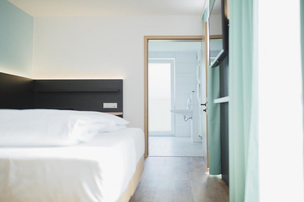 Postel nebo postele na pokoji v ubytování Hotel U7