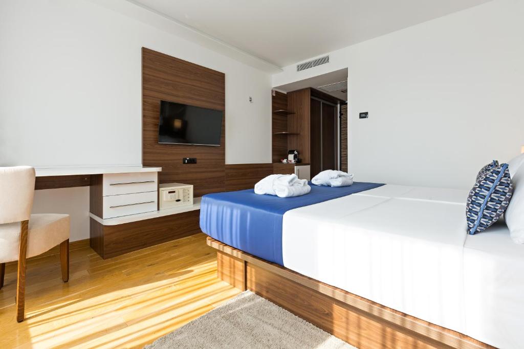 Postel nebo postele na pokoji v ubytování Abba Hotel