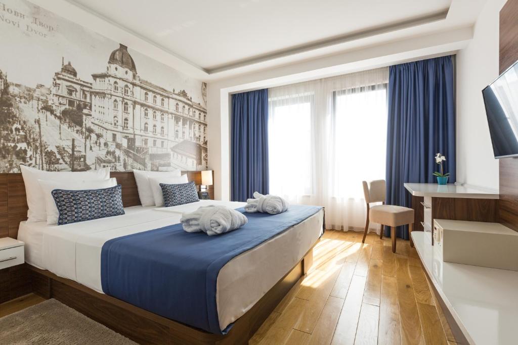 Postel nebo postele na pokoji v ubytování Abba Hotel