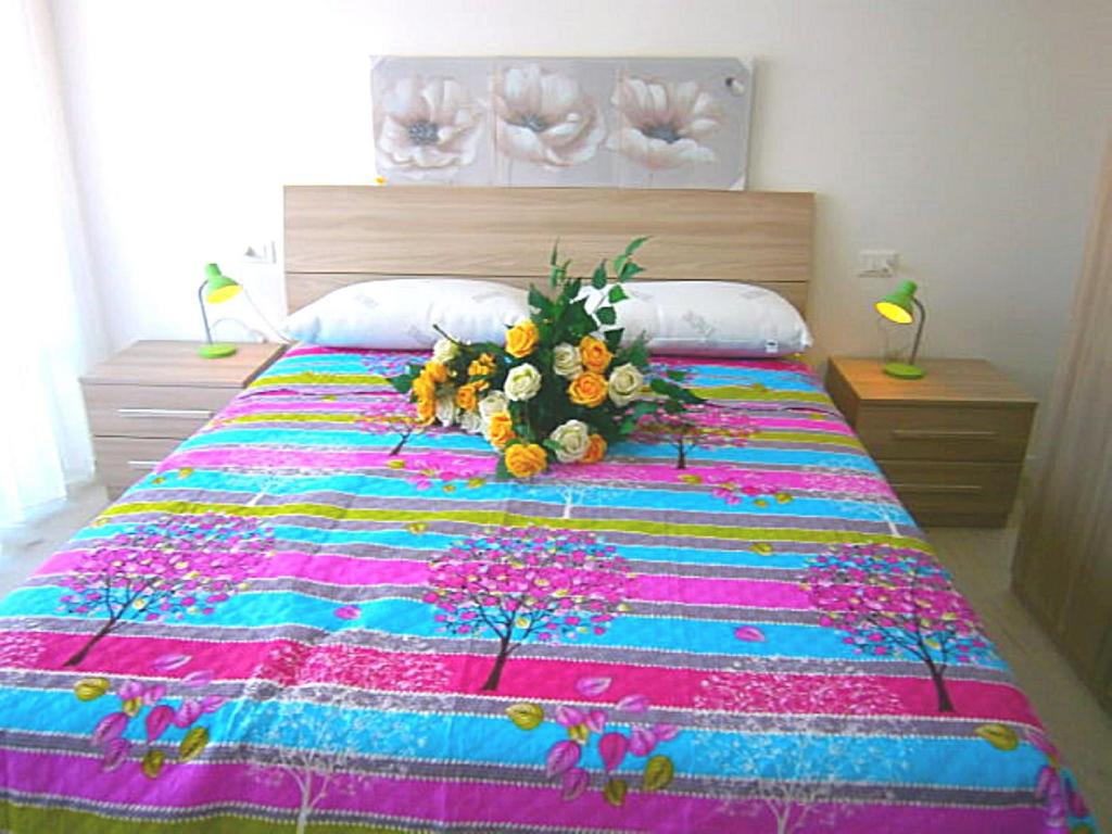 A bed or beds in a room at Cà Bianca