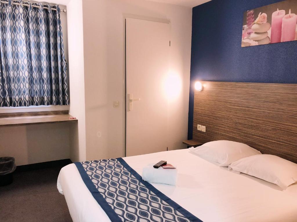 Postel nebo postele na pokoji v ubytování Fasthotel Lens Noyelles Godault