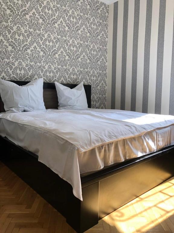 Postel nebo postele na pokoji v ubytování Apartment OLD KUTAISI
