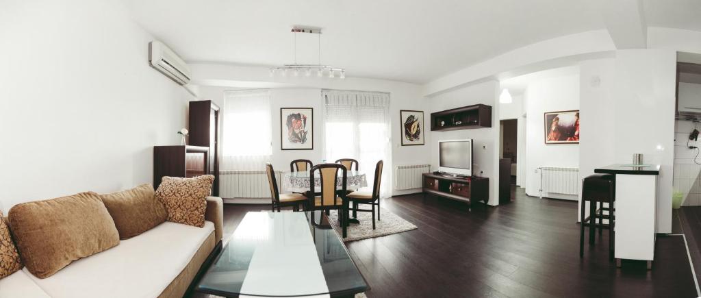 a living room with a couch and a table at Apartment Fila in Kočani