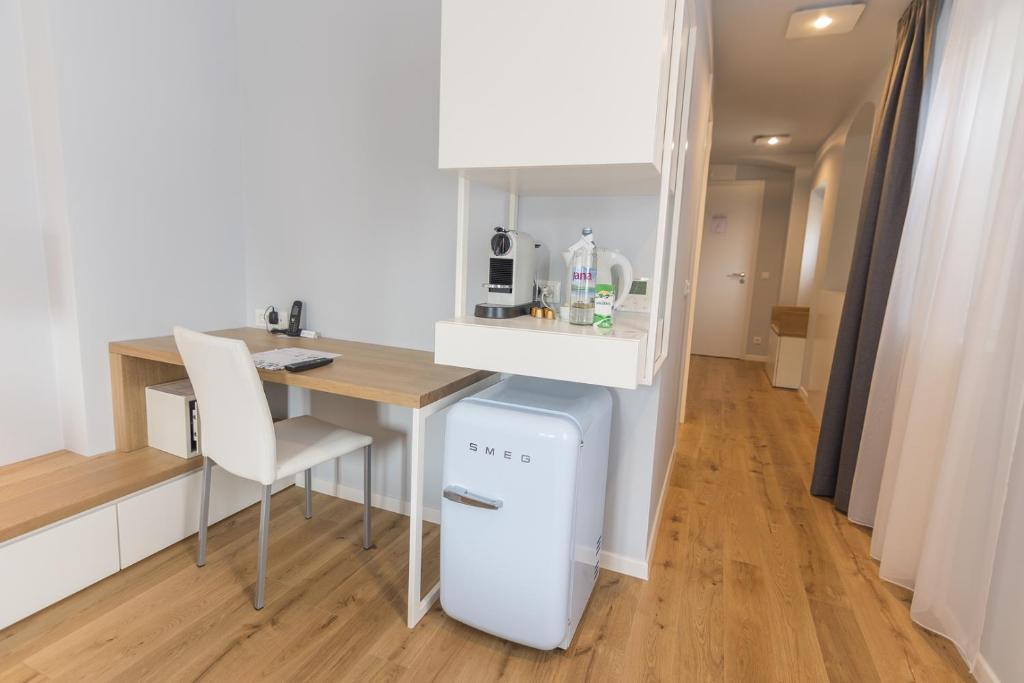 Kuchyň nebo kuchyňský kout v ubytování Divota Apartment Hotel