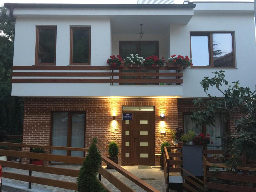 a house with flower boxes on the balcony at madox in Ohrid