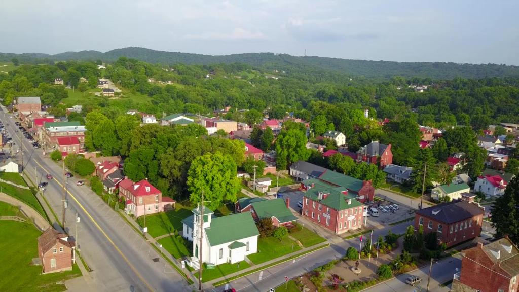 an aerial view of a small town with a road at Harbor Haus Inn & Suites in Hermann