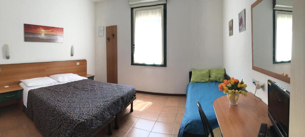 Postel nebo postele na pokoji v ubytování Hotel Stazione
