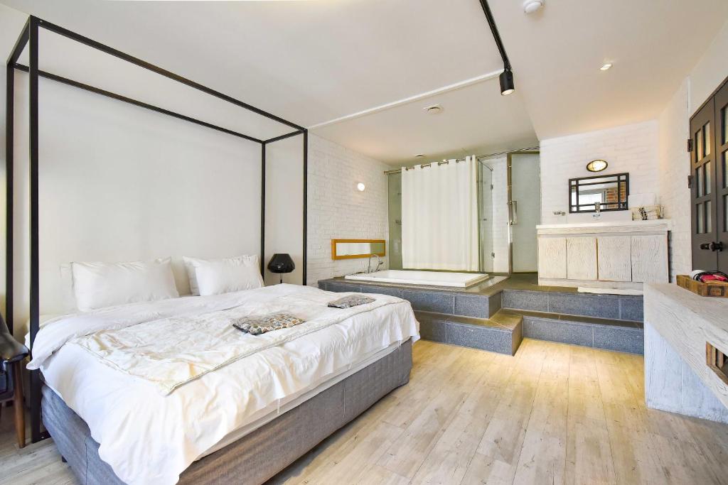 Postel nebo postele na pokoji v ubytování Hotel 25 Seomyeon
