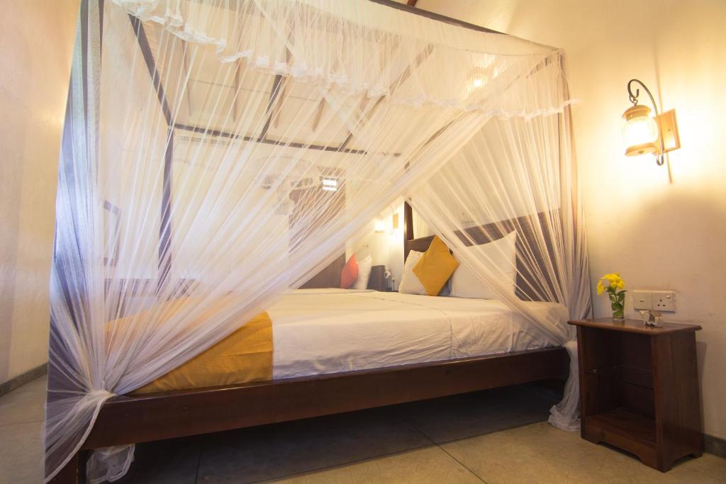 Postel nebo postele na pokoji v ubytování Weligama Ocean Breeze