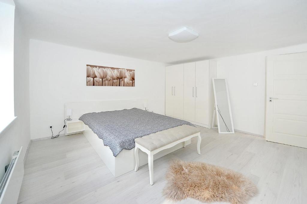 Postel nebo postele na pokoji v ubytování Pure Apartman Pécs