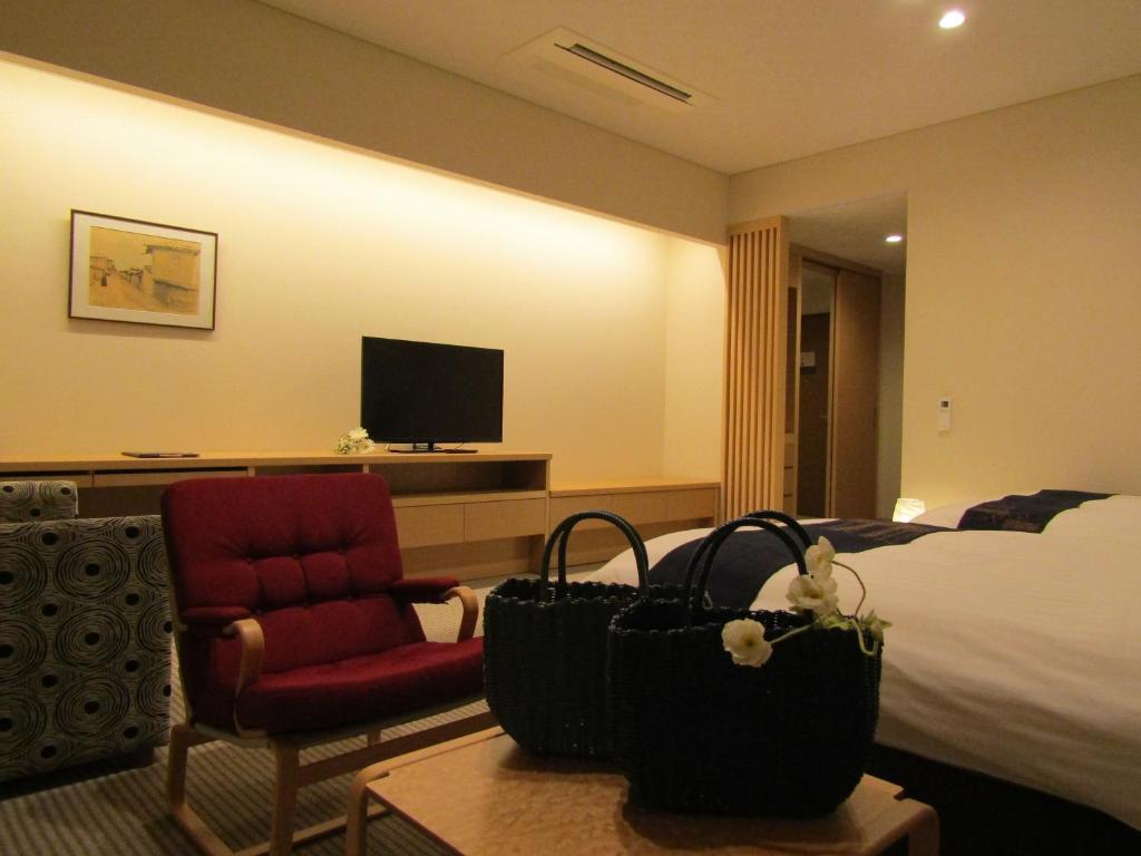 TV a/nebo společenská místnost v ubytování Japanese Style Hotel Isomura