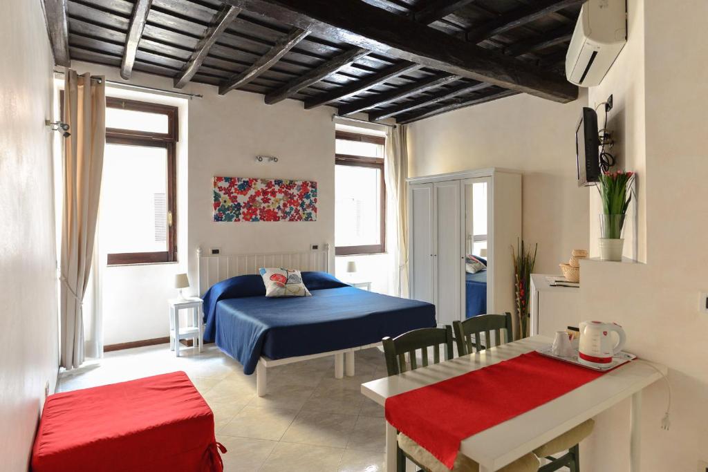 Кровать или кровати в номере Urbana Colosseo Boutique Apartment