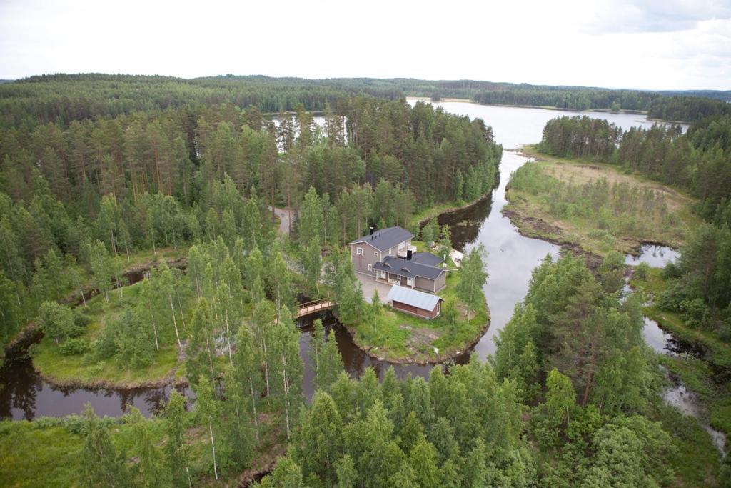 an aerial view of a house on an island in a river at Rantakatti Apartments in Punkaharju