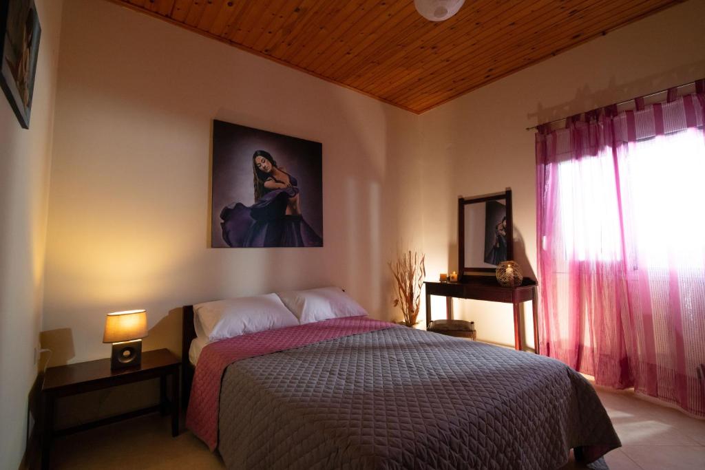 Postel nebo postele na pokoji v ubytování Villa Melissa