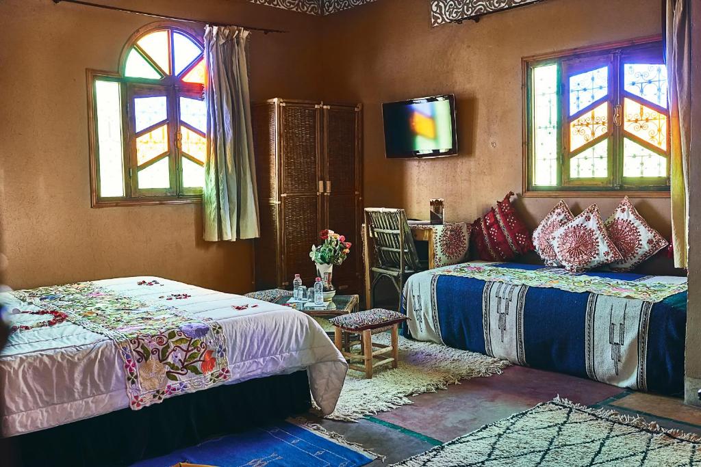 Un ou plusieurs lits dans un hébergement de l'établissement Riad Ouarzazate