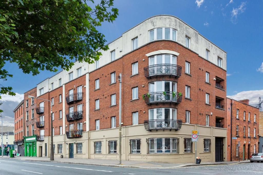 a large red brick building on a city street at Saint Paul's in Dublin