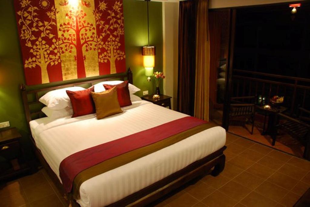 Postel nebo postele na pokoji v ubytování Siralanna Hotel