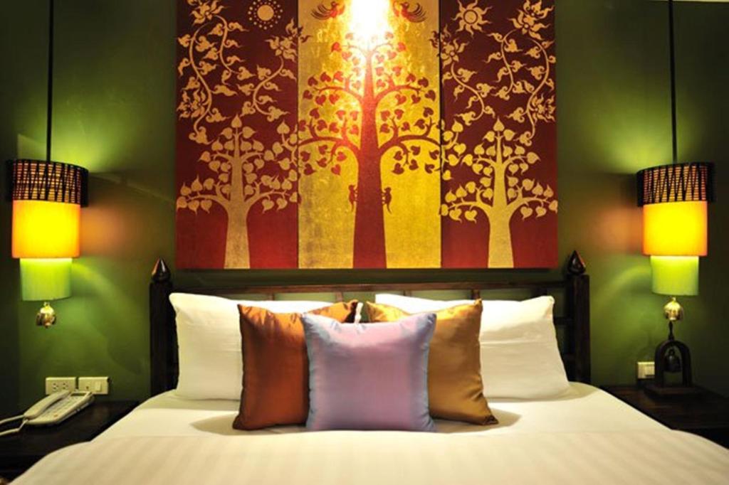 Postel nebo postele na pokoji v ubytování Siralanna Hotel