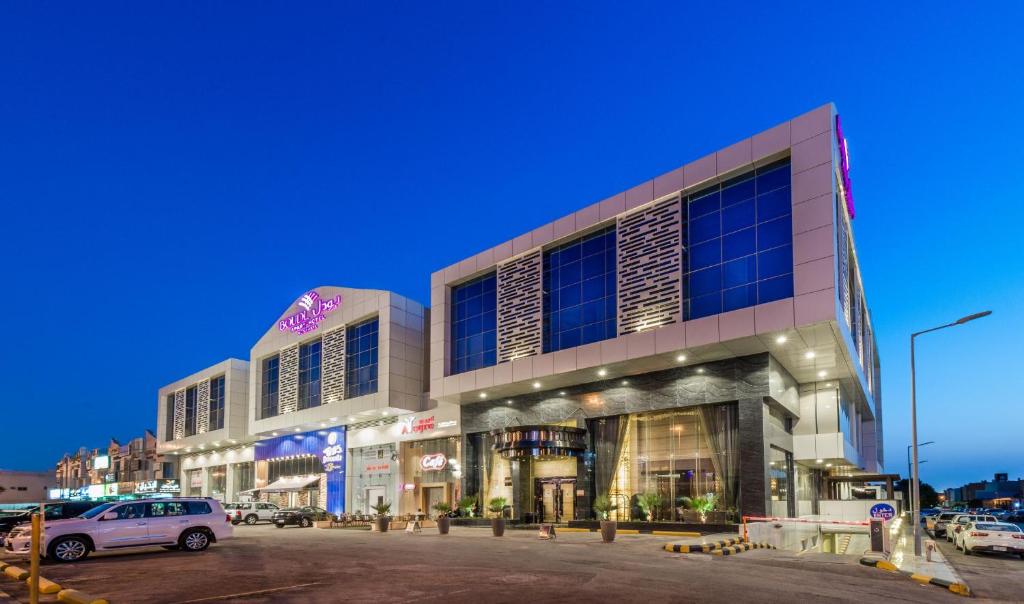 a building with a car parked in front of it at Boudl Al Sahafa in Riyadh