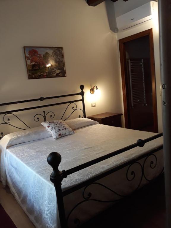 Postel nebo postele na pokoji v ubytování La Camelia B&B