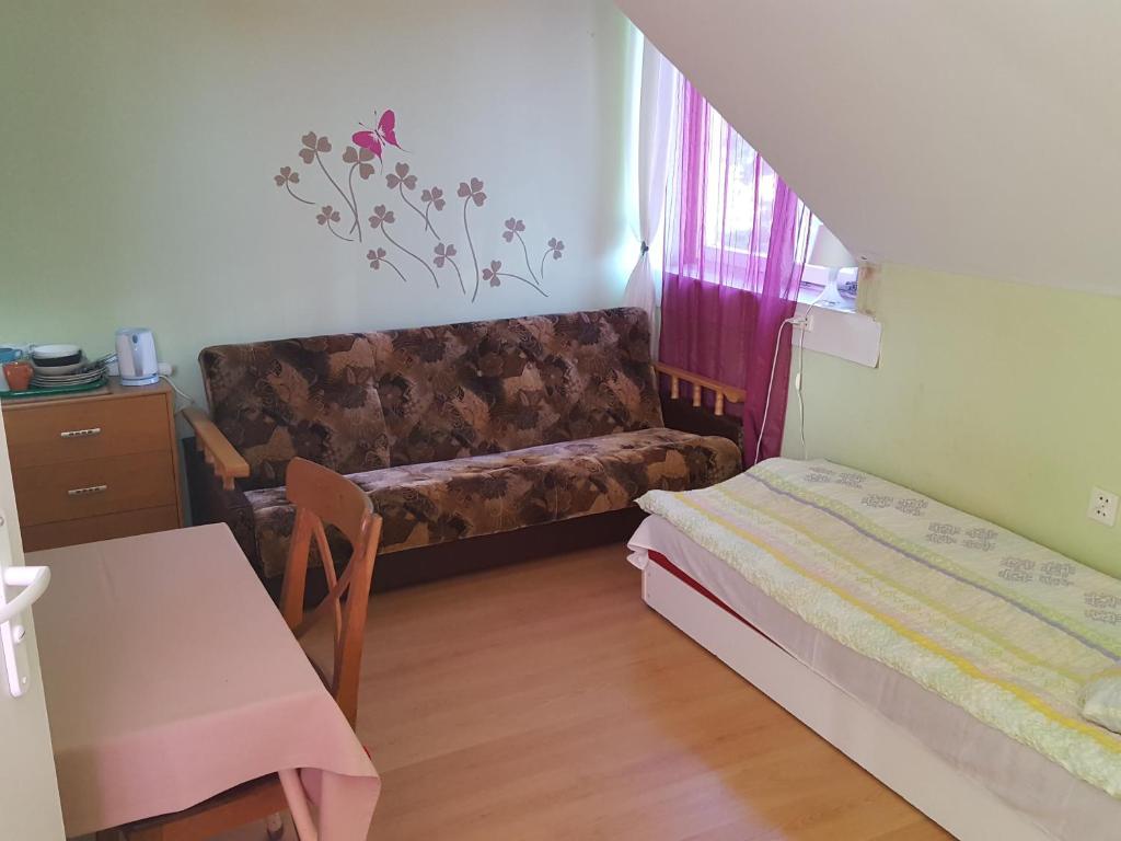 Łóżko lub łóżka w pokoju w obiekcie Willa Daniela