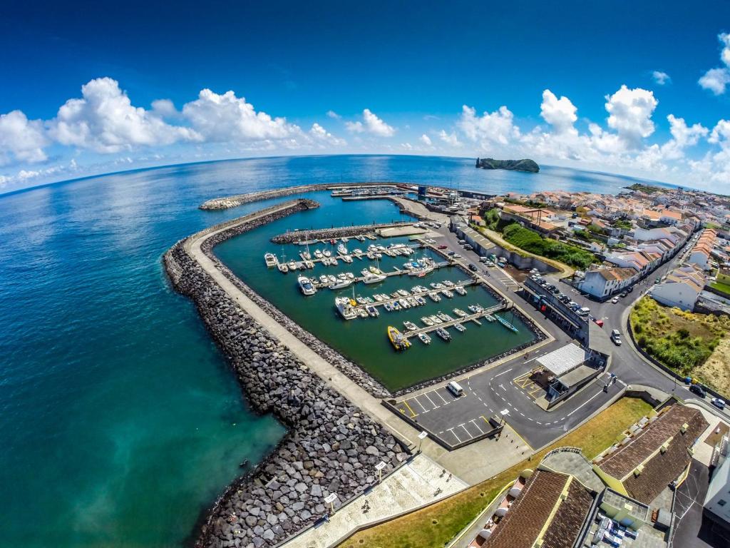 an aerial view of a marina next to the ocean at Vila Mar in Vila Franca do Campo