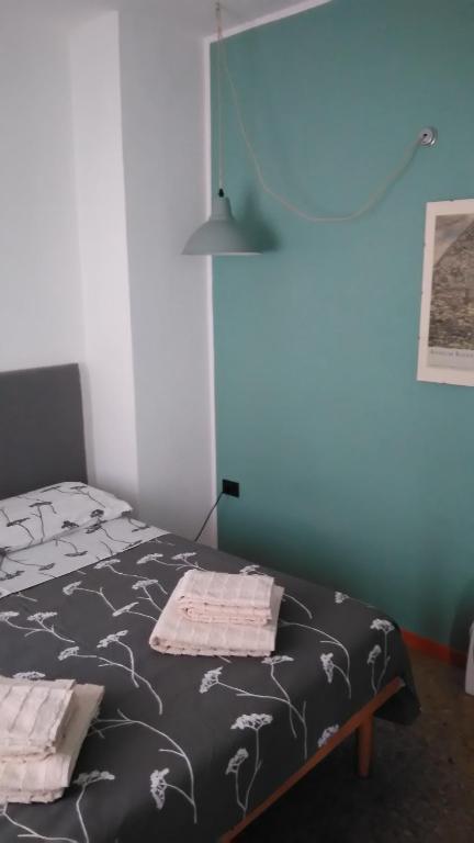 Postel nebo postele na pokoji v ubytování #iRicci3stanze