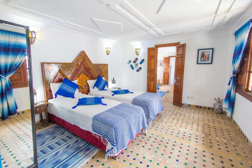 Postel nebo postele na pokoji v ubytování Riad Dar Skalli & SPA